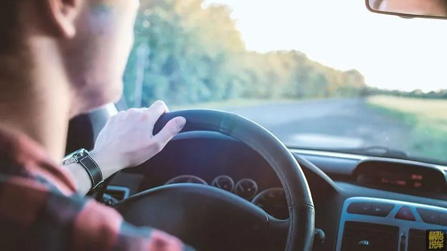 New driver checking mirrors and maintaining safe distance